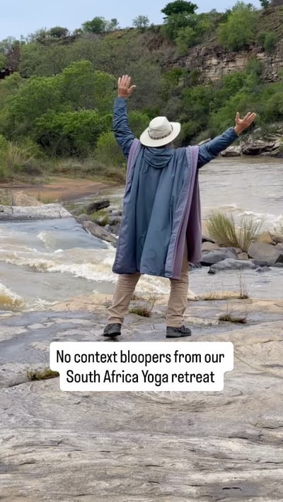 Flow Yoga Cedar Park student celebrating at river during South Africa yoga retreat Austin Texas