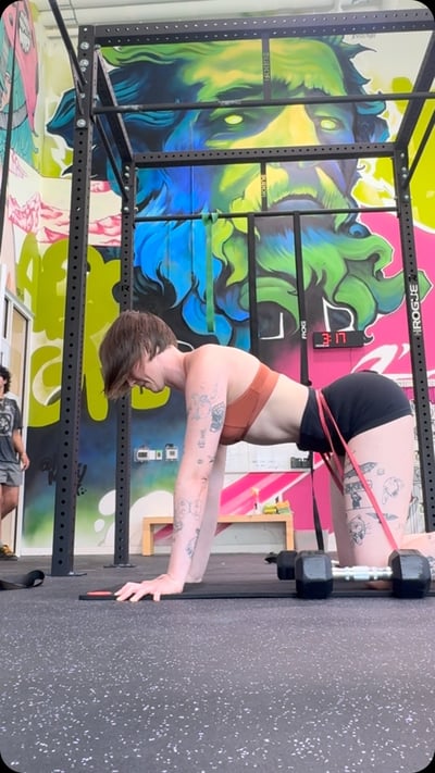 Flow Yoga Cedar Park instructor performing advanced yoga movement on rig structure Austin Texas