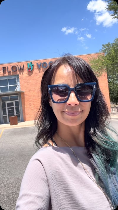 Flow Yoga Cedar Park community member smiling outside studio location Austin Texas