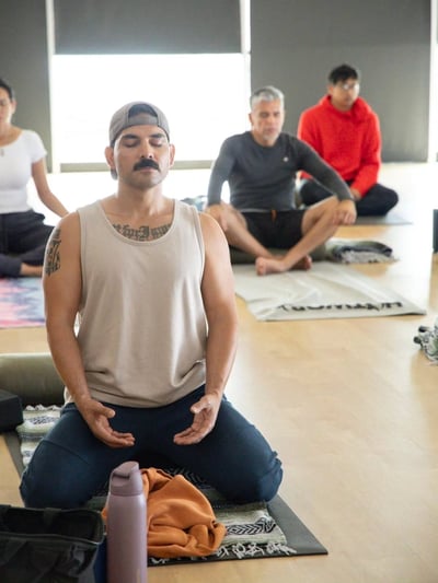 Flow Yoga Georgetown students practicing meditation and breathing together Austin Texas