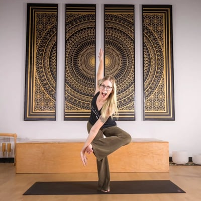 Flow Yoga Georgetown yoga teacher training instructor practicing balance pose Austin Texas