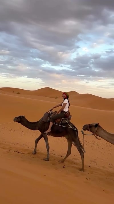 Flow Yoga Cedar Park instructor camel riding in Sahara desert Morocco Austin Texas