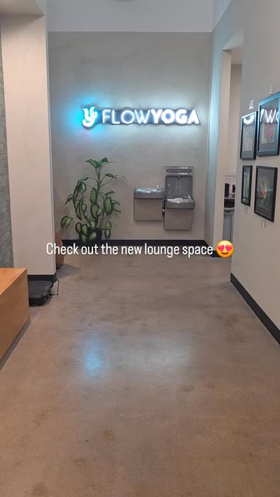 Flow Yoga Georgetown new renovated lounge space with blue logo Austin Texas