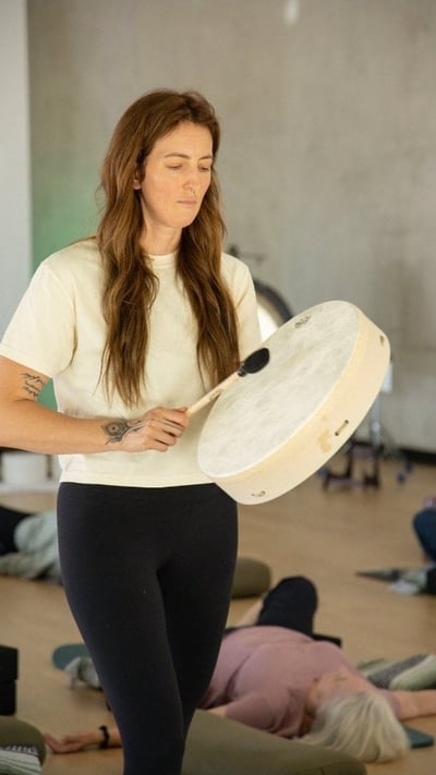 Flow Yoga Georgetown instructor leading sound bath healing session Austin Texas